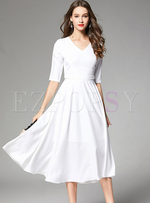 elegant white dress with sleeves