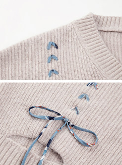 Fashion V-neck Belt-design Asymmetric Hem Sweater