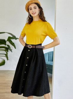 yellow top black skirt