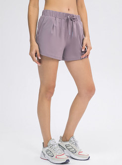 Solid Drawcord Ruched Yoga Shorts With Pockets
